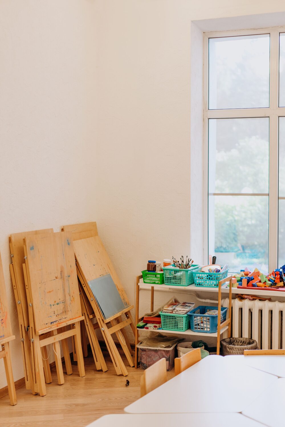 Art easels and craft supplies by the window